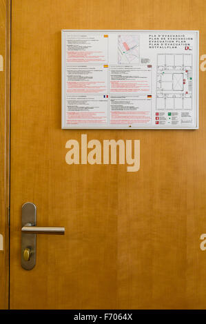 Emergency evacuation plan notice on hotel room door, Stock Photo