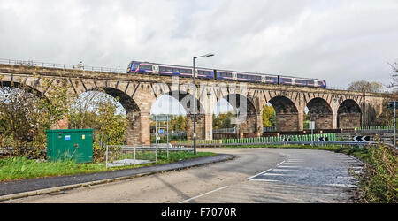 Castlecary railway Viaduct near Cumbernauld in Scotland with Class 170 Glasgow to Edinburgh Scotrail express passing over. Stock Photo