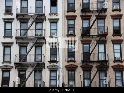 Outdoor Fire Escapes on Two Contrast Apartment Buildings in New York Stock Photo