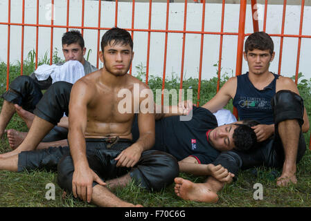 Four Wrestlers Resting, Kirkpinar 654th Oil Wrestling Championships, Edirne, Turkey (July 2015) Stock Photo