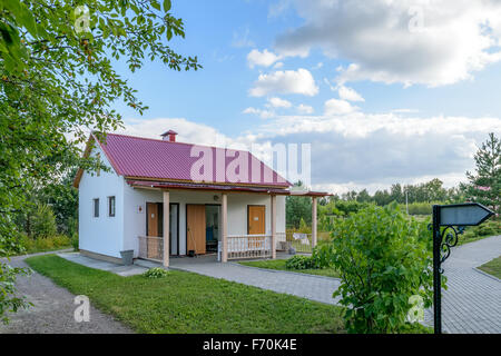 Public toilet in a beautiful park in the evening. Side view. Stock Photo