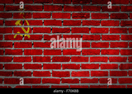 Dark brick wall texture - flag painted on wall - USSR Stock Photo