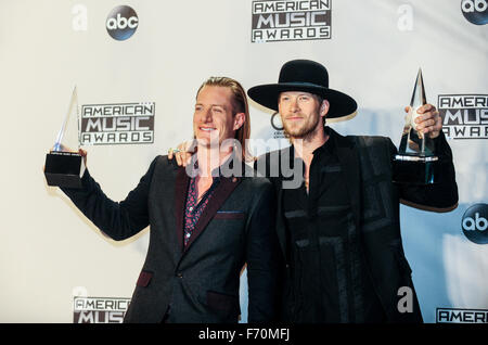 Los Angeles, USA. 22nd Nov, 2015. Tyler Hubbard (L) and Brian Kelley of Florida Georgia Line pose with their award for Favorite Duo or Group - Country during the 2015 American Music Awards at Microsoft Theater in Los Angeles, California, the United States, Nov. 22, 2015. Credit:  Zhang Chaoqun/Xinhua/Alamy Live News Stock Photo