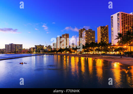 View of Honolulu and Waikiki Beach at night; Hawaii, USA Stock Photo