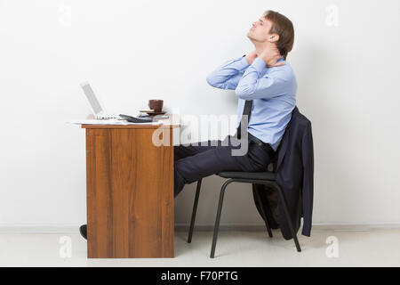 Businessman Using Computer Suffering From Neck Ache Stock Photo