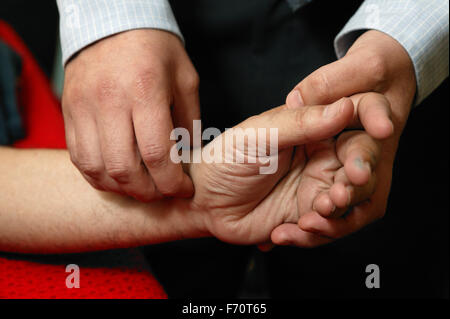 Practitioner taking pulse, Stock Photo
