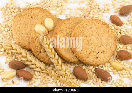 Healthy integral cookies with almonds and wheat plant on white background Stock Photo