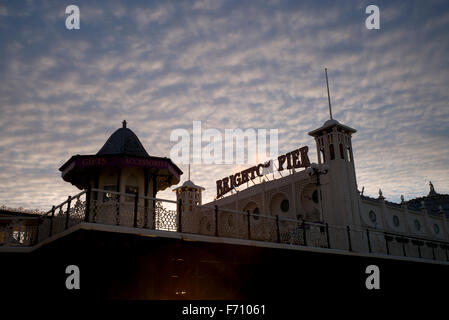 Brighton pier sign and kiosk, early morning, clouds Stock Photo