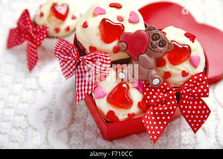 Red velvet cupcakes decorated with hearts Stock Photo