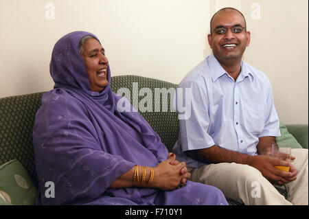 Mother and son chatting on the sofa, Stock Photo