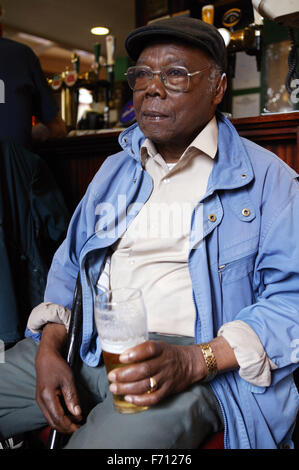 Man having a drink in the pub, Stock Photo