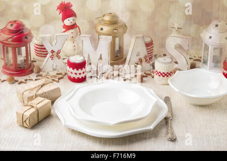 Christmas composition. Christmas table setting with christmas decorations. Image toned in vintage style. Stock Photo