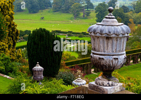 View across the formal garden at Powis Castle near Welshpool Powys Wales UK with decorative stone urn in the foreground Stock Photo