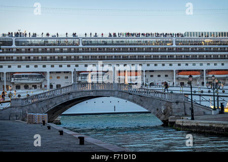 Venice, Italy. Cruise ship, MSC Opera, arriving in Venice with tourists standing on deck Stock Photo