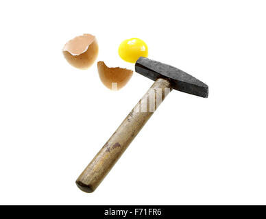 you can't make an omlet without braking a few eggs proverb hammer broken egg isolated on white background Stock Photo