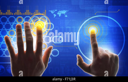 Hands touching holographic screen Stock Photo