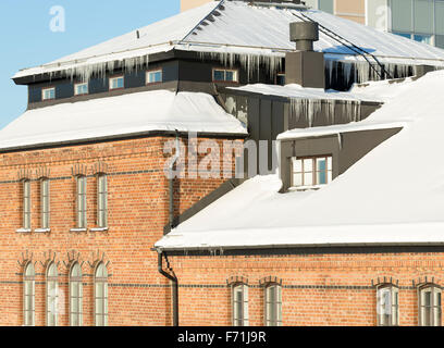 Icicles Hanging from Roof Stock Photo