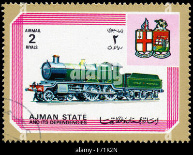 AJMAN STATE - CIRCA 1972: A stamp printed in United Arab Emirates, shows locomotive, series, circa 1972 Stock Photo