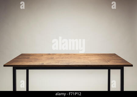 Wooden table against gray background. Stock Photo