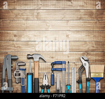 Various carpentry, repairing, DIY tools on wooden background Stock Photo