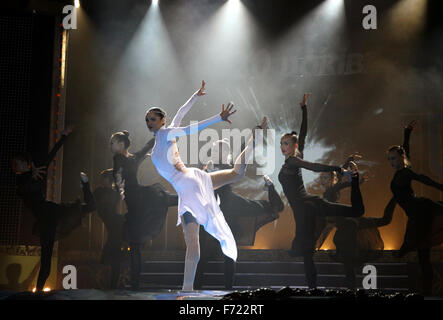 KYIV, UKRAINE - DECEMBER 17, 2010: Hanna Bessonova (in White) and other artistic gymnasts dance during the concert timed to Jacques Rogge's official visit to Ukraine on December 17, 2010 in Kyiv, Ukraine Stock Photo