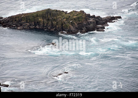 Strong ocean current and rocks close to Mykines on the Faroe Islands Stock Photo