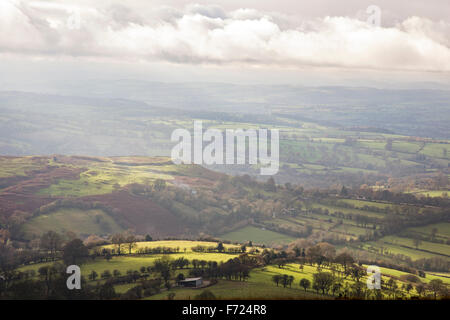 Looking west across Shropshire countryside towards Nordy Bank Iron Age hill fort, from Brown Clee Hill, Shropshire, England, UK Stock Photo