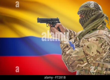 Male in muslim keffiyeh with gun in hand and national flag on background series - Colombia