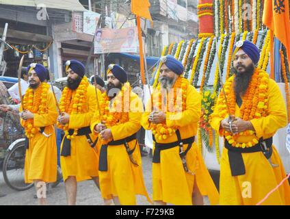 Allahabad, India. 23rd Nov, 2015. Panj Pyare take out a religious procession during Birth Anniversary Celebrations of Guru Nanak Dev Ji in Allahabad.Guru Nanak was the founder of Sikhism and the first of the Sikh Gurus. His birth is celebrated world-wide as Guru Nanak Gurpurab on Kartik Poornima, the full-moon day which falls on different dates each year in the month of Katak, October–November. Credit:  Amar Deep/Pacific Press/Alamy Live News Stock Photo