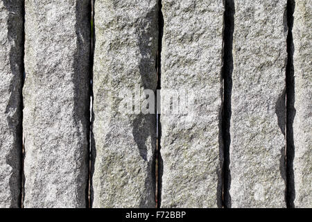 Background of granite stone wall texture, close up Stock Photo