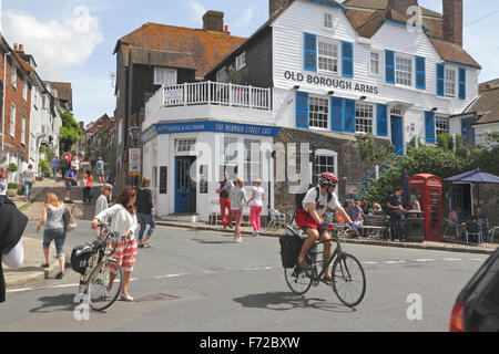 Bikes and pedestrians on Mermaid Street, Rye, East Sussex, UK Stock Photo