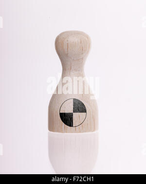 Wooden pawn with a painting of a flag, Crash test dummy Stock Photo