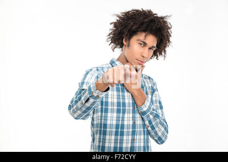 Portrait of a young afro american man pointing finger at camera isolated on a white background Stock Photo