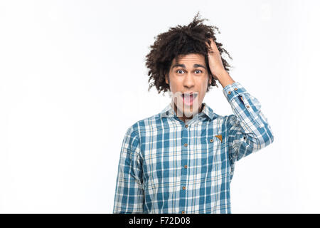 Portrait of amazed afro american man with curly hair looking at camera isolated on a white background Stock Photo