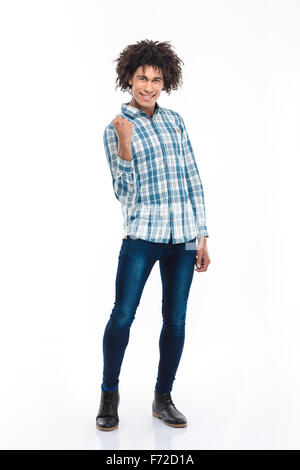 Full length portrait of a happy afro american man celebrating his success isolated on a white background Stock Photo