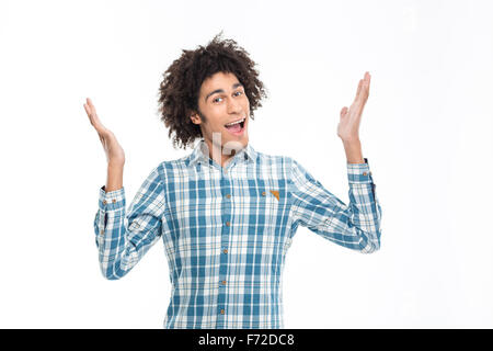 Portrait of a cheerful afro american man with curly hair standing isolated on a white background Stock Photo