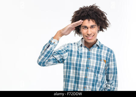 Portrait of a happy afro american man saluting isolated on a white background Stock Photo