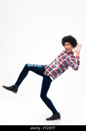 Full length portrait of afro american man falling isolated on a white background Stock Photo
