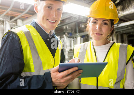 Engineers working in temperature control room Stock Photo
