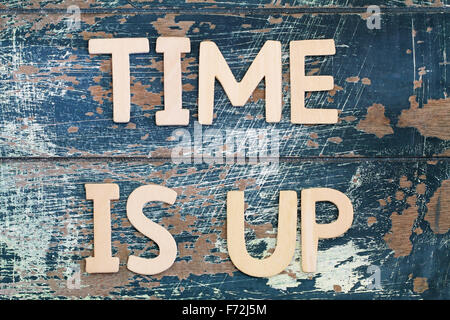 Time is up written with wooden letters on rustic surface Stock Photo