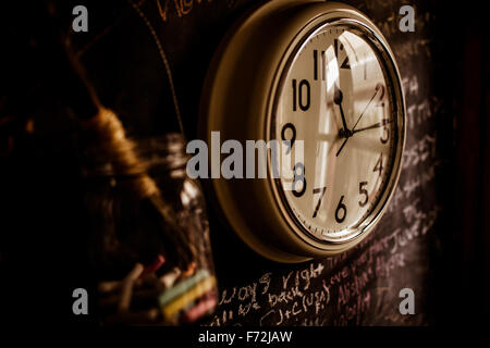 Clock on kitchen wall Stock Photo