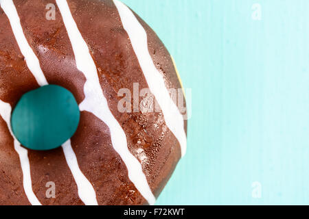 Chocolate Donut On Blue Background Stock Photo