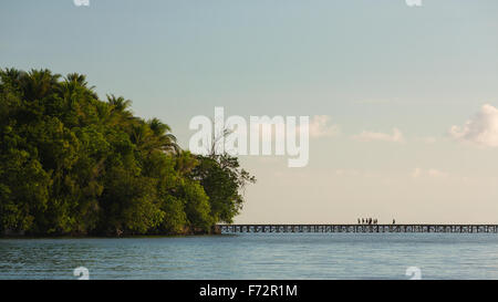 Panorama of the indigenousness people from the Bajo village on the Togean Islands crossing the bridge to the mainland, Indonesia, Asia
