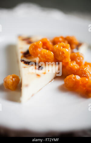 Finnish cheese with fresh cloudberries Stock Photo
