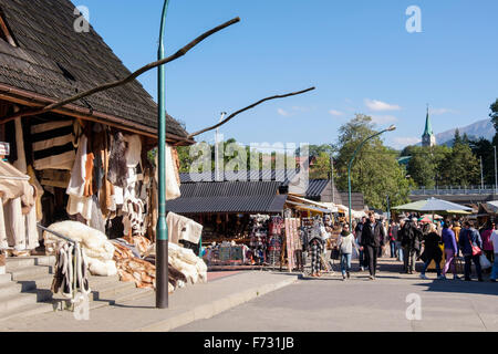 Stalls selling furs and skins in market on busy Krupowki Street, Zakopane, Tatra County, Poland, Europe Stock Photo