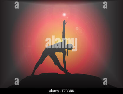 A yoga woman silhouette performing triangle pose on a dark colourful background with a glare Stock Photo