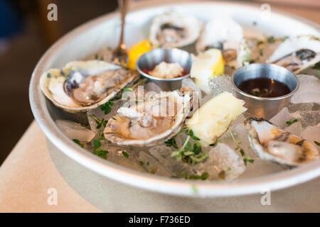 Close up of a plate of fresh oysters. Stock Photo