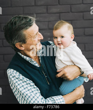 A grandfather and baby granddaughter. Stock Photo