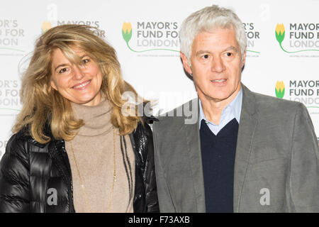 Halcyon Gallery, London, November 24th 2015. Mayor of London Boris Johnson joins celebrities and business leaders at Mayfair’s Halcyon Gallery where pictures from a book showcasing London’s true colours will be sold to raise money for the Mayor’s Fund For London, which helps disadvantaged youths gain a foothold on the employment ladder. PICTURED: Celebrity hairstylist John Frieda with partner Avery Agnelli Credit:  Paul Davey/Alamy Live News Stock Photo