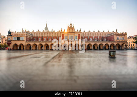 Empty Market square with beautiful Cloth Hall in Krakow on the morning sunrise Stock Photo